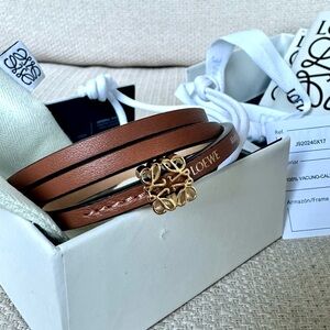 SOLD: NWT Loewe Twist bangle in calfskin — tan with gold anagram dice, size M